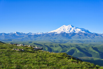 Fototapeta premium Highland summer meadow with Mount Elbrus landscape