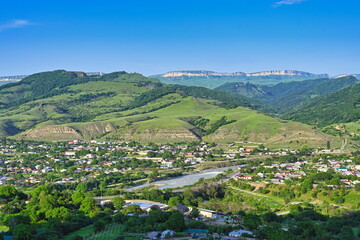 Obraz premium Mountain landscape of the village Kosta Khetagurov on a summer day, Karachay-Cherkessia Republic of Russia