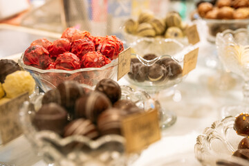 Vibrant Pink Truffle Chocolates Displayed in a Glass Bowl

