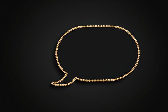 a gold bea necklace with a black background