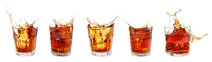 Set of glasses with splashing rum on white background