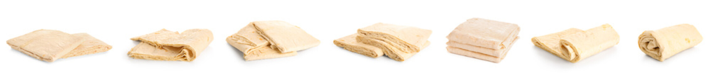 Set of fresh thin lavash on white background