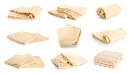 Set of fresh thin lavash on white background