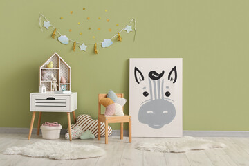 Picture and toy house in children's room
