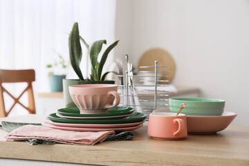 Cups, plates and napkin on counter in kitchen. Closeup