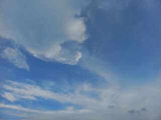 Obraz premium Blewing white clouds in the blue sky
