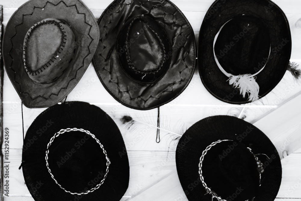 Poster a collection of hats displayed on a wall.