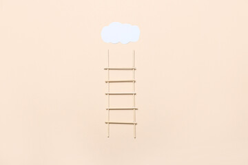 Ladder with cloud on beige background