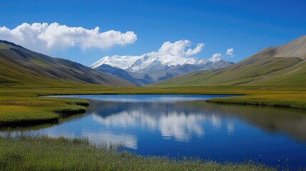 Fototapeta premium Serene Landscape with Reflective Lake and Majestic Mountains under Blue Sky