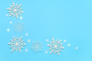 Beautiful decorative snowflakes on blue background