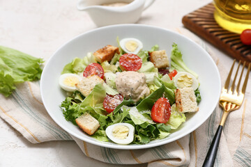 Plate with tasty Caesar salad on white background, closeup