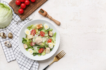 Bowl with tasty chicken Caesar salad and ingredients on white background