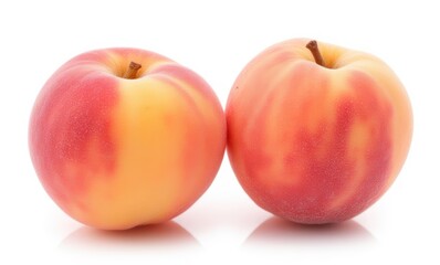 Fresh yellow-orange nectarines on white background