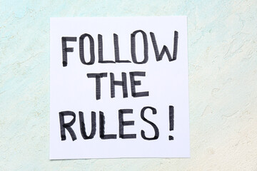 Fototapeta premium Paper with text KNOW THE RULES on light grunge background