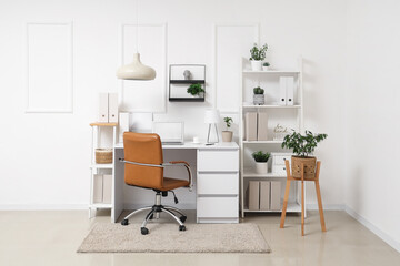 Comfortable workplace with laptop in modern office