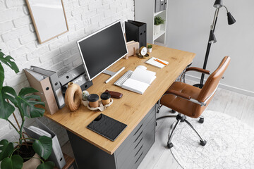 Workplace with computer and book in modern office