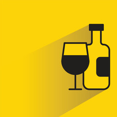wine glass and bottle icon with shadow on yellow background