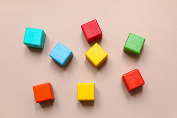 Colorful building cubes on beige background