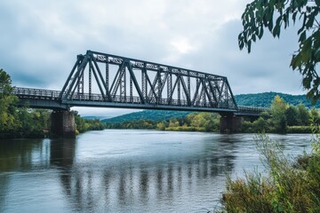 Naklejka premium Steel bridge spanning a serene river landscape scenic viewpoint capturing industrial architecture in nature's embrace