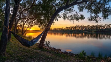 Serene Sunset Hammock Scene Beside Tranquil Lake