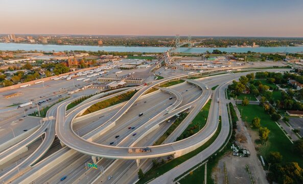 Aerial view of a busy highway interchange, border crossing, and cargo area.  US CUSTOMS AND BORDER PROTECTION - INSPECTION FACILITY, DETROIT, MICHIGAN, UNITED STATES