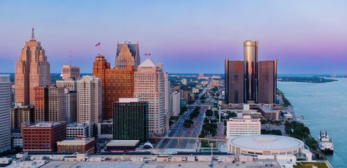 Detroit skyline at sunset, showcasing iconic skyscrapers and the Detroit River. Urban landscape....