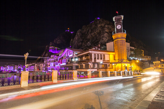 Old Ottoman houses and Clock Tower with night and bridge view by the Yesilirmak River in Amasya. Amasya is populer tourist destination in Turkey.
