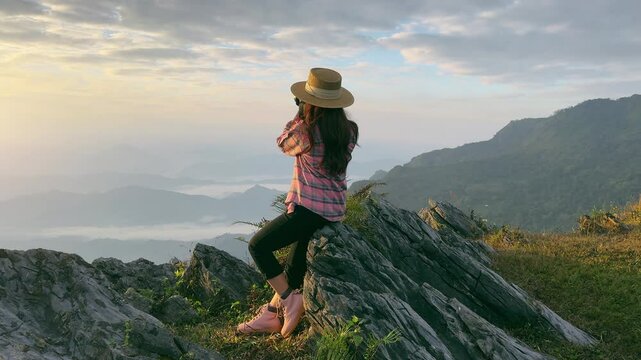 Tourist taking photography and enjoy nature panoramic landscape at Doi pha mon mountains in Chiang rai, Thailand.