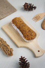 a toast with beef floss topping on a white table photographed with studio lighting and wooden theme props