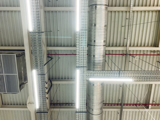 Fototapeta premium The ceiling features numerous lights that are elegantly suspended from its surface, creating a vibrant and illuminated atmosphere in the room, enhancing its overall aesthetic appeal