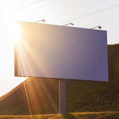 Advertising billboard along the road in the city on a sunny day. Background for design.