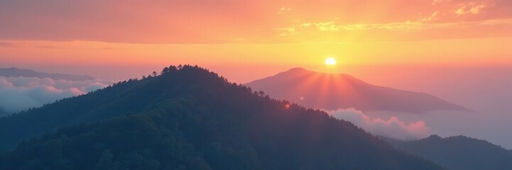 Obraz premium Gentle hill shrouded in misty clouds against a warm sunset sky, subtle contrast, natural, hill