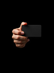 Hand showing credit card isolate on black background.