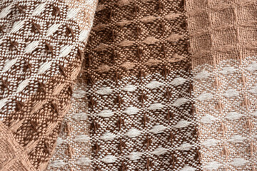 Brown plaid texture. Presentation of the fashionable color of 2025 mocha mousse. Warm, cozy shades...