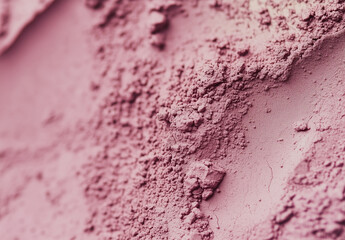 Clay cosmetic texture on the background, close-up. Background of smudged cream for face or body mask. Close-up of a pink creamy swatch.