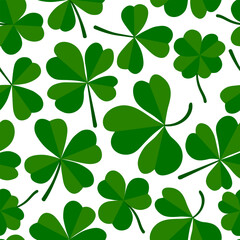 Fototapeta premium Shamrock or clover leaf flat design green seamless pattern falling leaves on white background vector illustration. Irish holiday celtic St Patrick day motif seamless pattern with shamrock clover leaf.