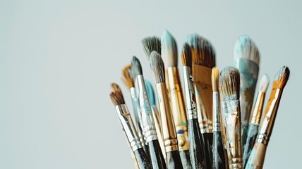 Fototapeta premium Various paintbrushes arranged together, showcasing different shapes and sizes for artistic projects