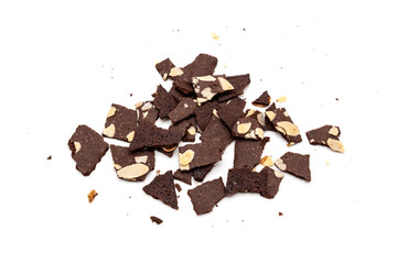 Crispy cracker snack are broken into small pieces. A pile of brittle brownie with almond nut isolated on white background.
