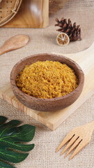 "Sambal Lingkung" is a typical food from Palembang, Indonesia. namely a type of floss made from catfish meat, in a wooden bowl photographed in the studio with a wooden theme prop