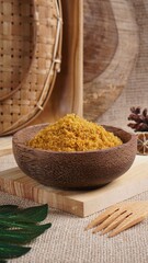 "Sambal Lingkung" is a typical food from Palembang, Indonesia. namely a type of floss made from catfish meat, in a wooden bowl photographed in the studio with a wooden theme prop