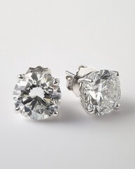 Elegant silver stud earrings featuring large, brilliant round cut diamonds.