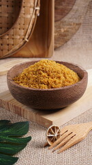 "Sambal Lingkung" is a typical food from Palembang, Indonesia. namely a type of floss made from catfish meat, in a wooden bowl photographed in the studio with a wooden theme prop