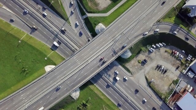 A Captivating Aerial View of a Busy Urban Traffic Interchange and Its Surroundings. Stock Clip