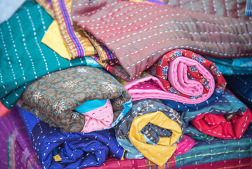 Obraz premium Godhadi (Blanket), handstitched quilt featuring a patchwork of different fabrics and patterns., colorful quilts, beautiful bedspreads
