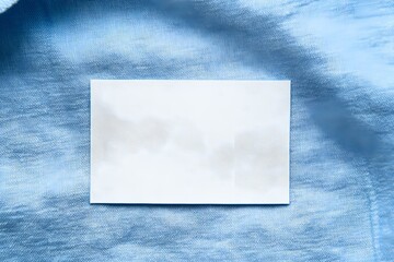 Elegant Blank White Laundry Care Clothes Label on Blue Shirt for Professional and Stylish Presentation