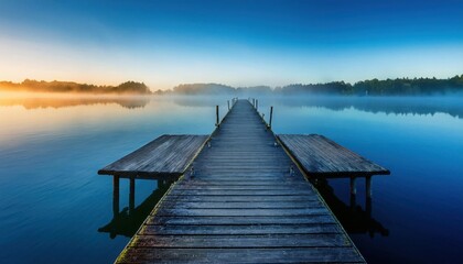 Obraz premium Serene Sunrise Lake Pier, Misty Morning - • Tranquility and Mindful.