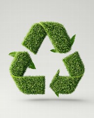 Green recycling symbol made of grass, symbolizing eco-friendliness and sustainability.