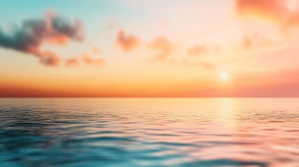 Fototapeta premium A serene sunset over calm waters, blending vibrant colors of orange, pink, and blue, creating a tranquil atmosphere.