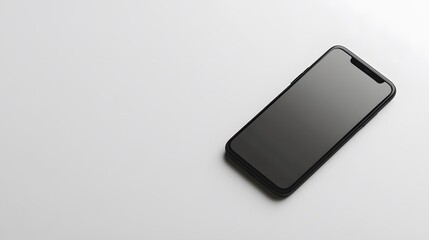 A sleek black smartphone lying flat on a white surface
