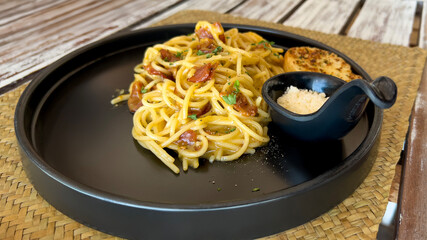 delicious spaghetti carbonara with cream and parmesan cheese